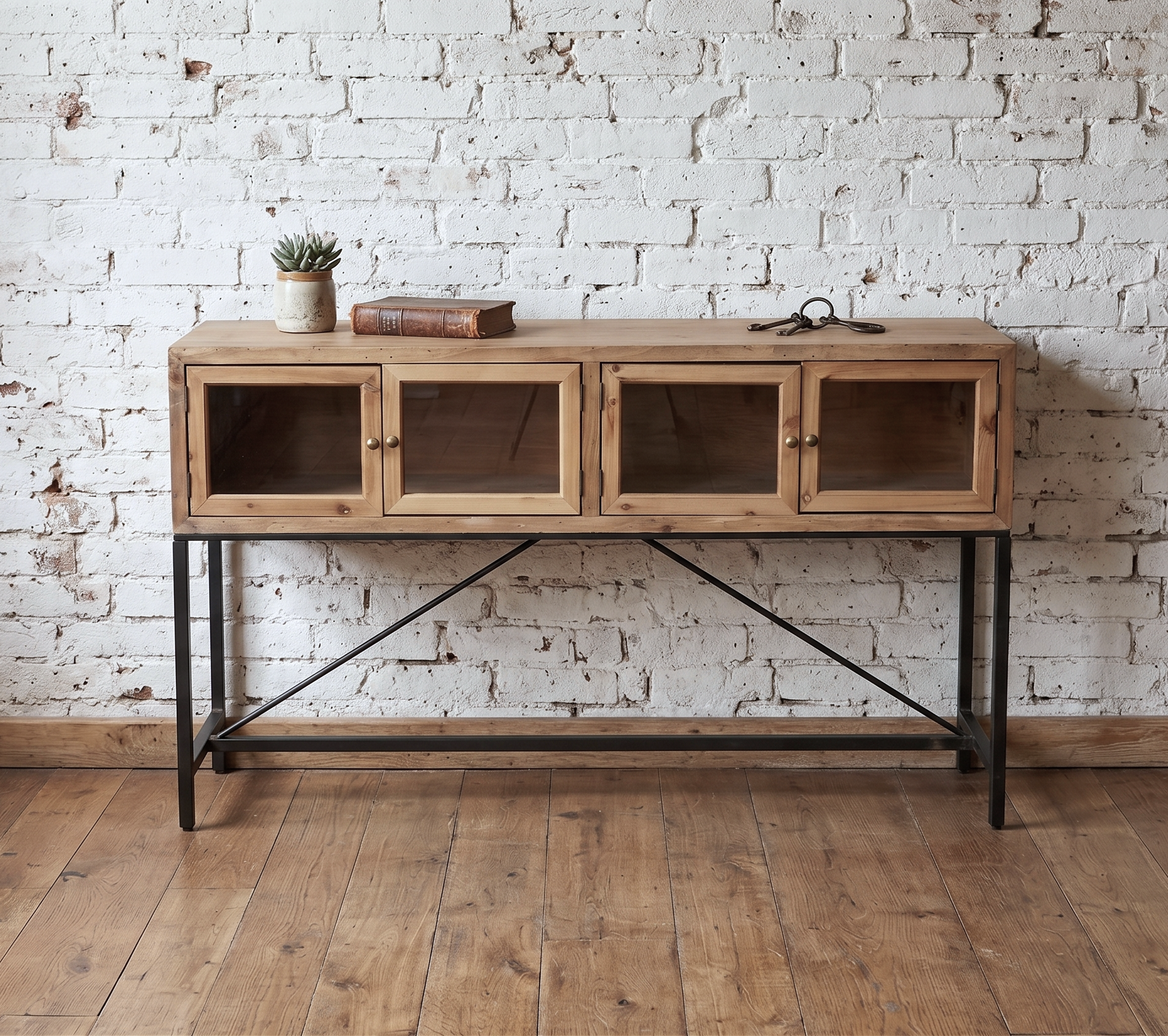 A wooden console table with glass doors and black steel framed legs - Cambrewood
